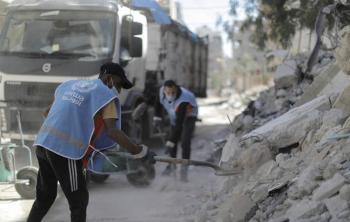 UNRWA sanitation workers clear the streets and collecting the rubble from the recent escalation in violence on the beseiged Gaza Strip. © 2021 UNRWA Photo Mohammed Hinnawi