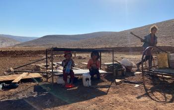 Children from Ras al Tin following the confiscation of their homes, water tanks and livelihood structures by Israeli forces, 14 July 2021. Photo by OCHA